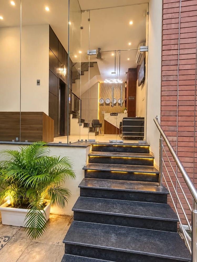 Hotel Vyom Residency glass entrance and staircase
